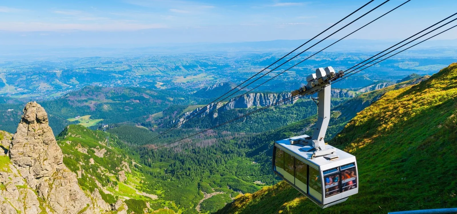 Kasprowy Wierch cable car travelling above a green Tatra valley in summer